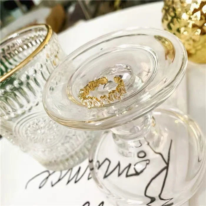 18K gold plated index finger ring with zircon accents on a white background