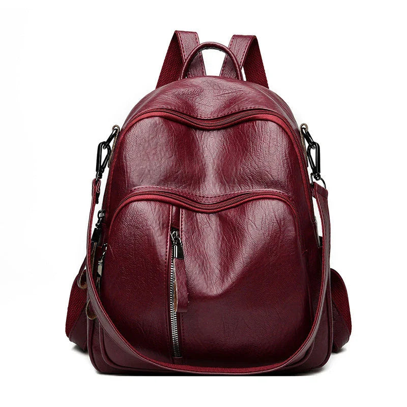 Stylish PU backpack in black, red, and blue colors with multiple compartments and adjustable straps for versatile and organized storage