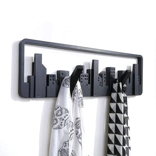 Wall-mounted coat rack with modern, artistic design and 5 flip-down hooks for storing coats, hats, scarves, and more