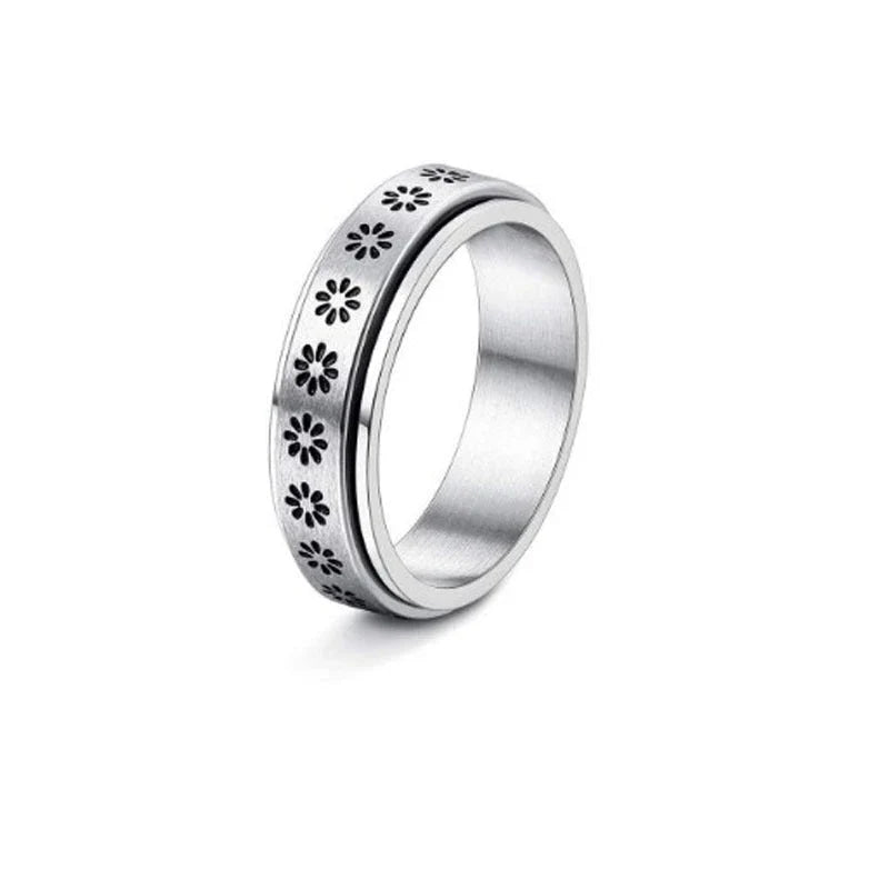 Elegant stainless steel spinner ring with a captivating moon and star design that rotates effortlessly for a calming tactile experience