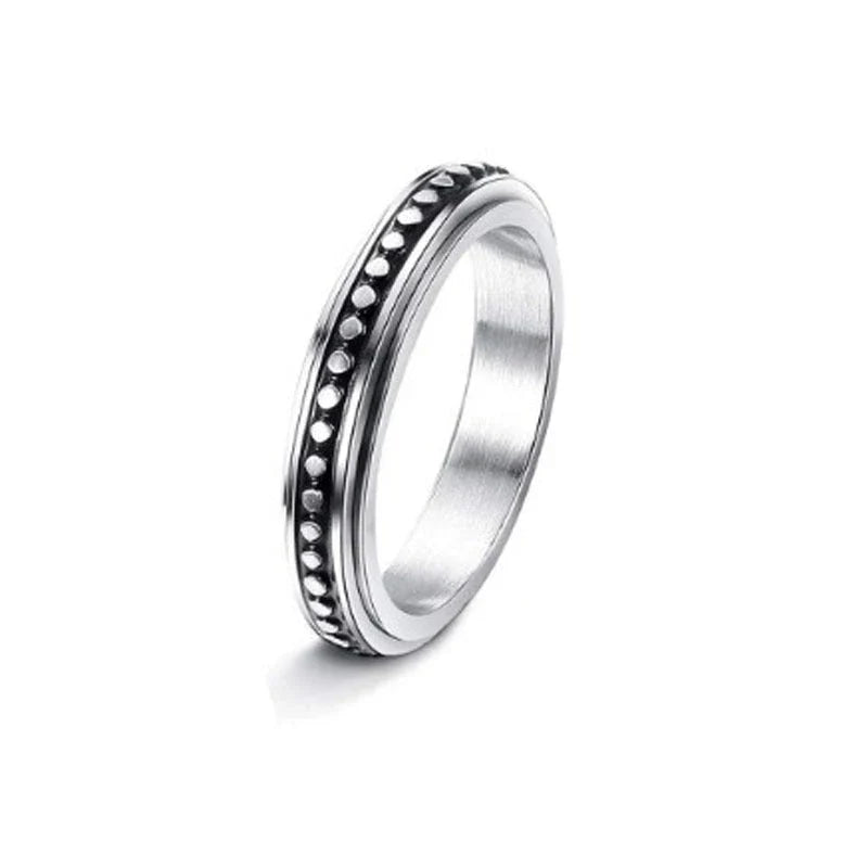 Elegant stainless steel spinner ring with a captivating moon and star design that rotates effortlessly for a calming tactile experience