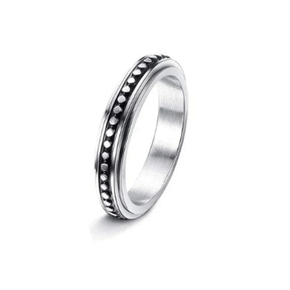 Elegant stainless steel spinner ring with a captivating moon and star design that rotates effortlessly for a calming tactile experience