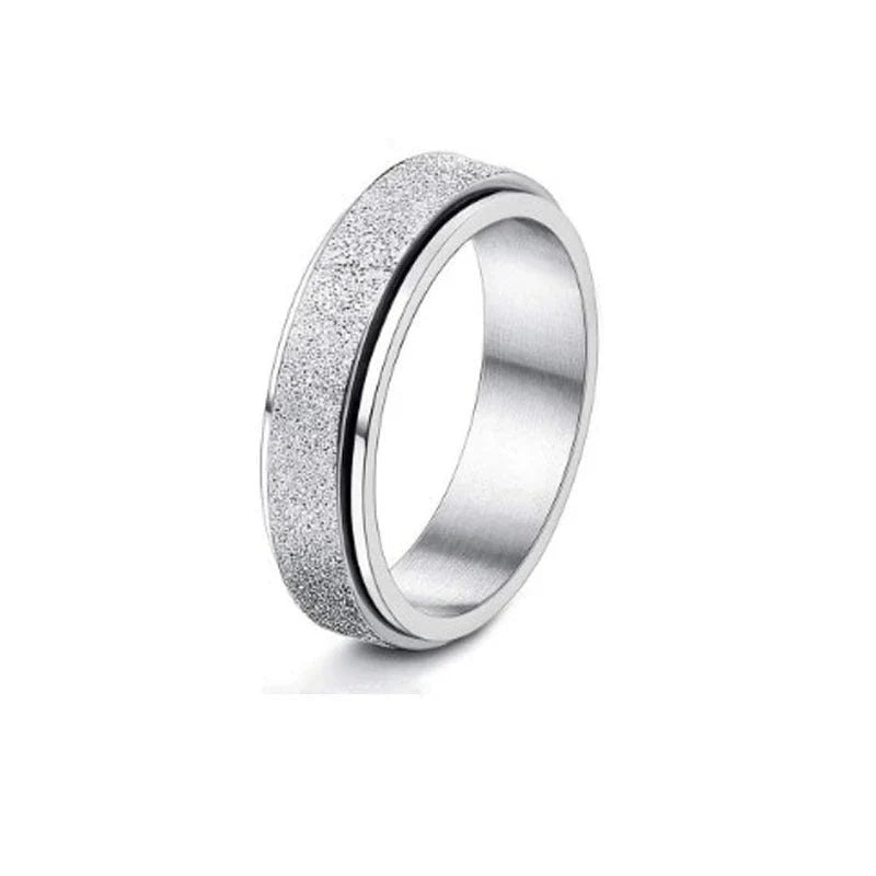 Elegant stainless steel spinner ring with a captivating moon and star design that rotates effortlessly for a calming tactile experience