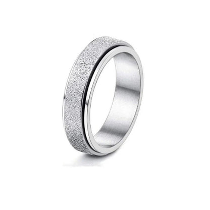 Elegant stainless steel spinner ring with a captivating moon and star design that rotates effortlessly for a calming tactile experience