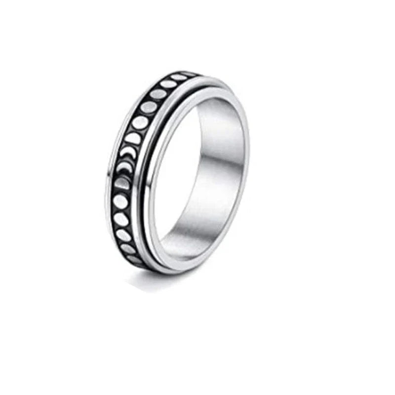 Elegant stainless steel spinner ring with a captivating moon and star design that rotates effortlessly for a calming tactile experience