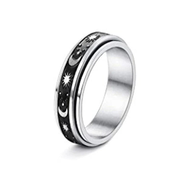 Elegant stainless steel spinner ring with a captivating moon and star design that rotates effortlessly for a calming tactile experience