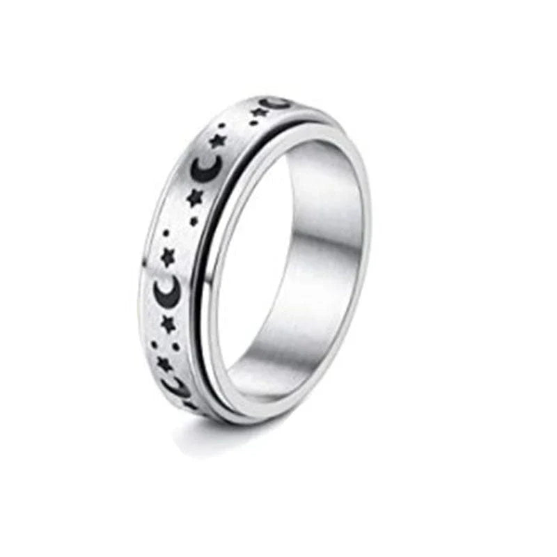 Elegant stainless steel spinner ring with a captivating moon and star design that rotates effortlessly for a calming tactile experience