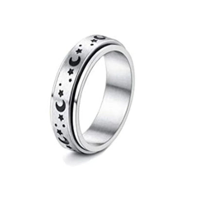 Elegant stainless steel spinner ring with a captivating moon and star design that rotates effortlessly for a calming tactile experience