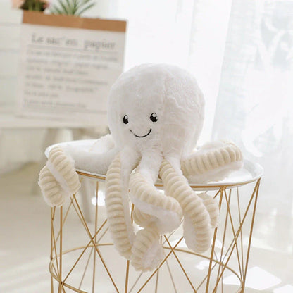 Plush octopus toy with big, bright eyes and a charming, smiling expression