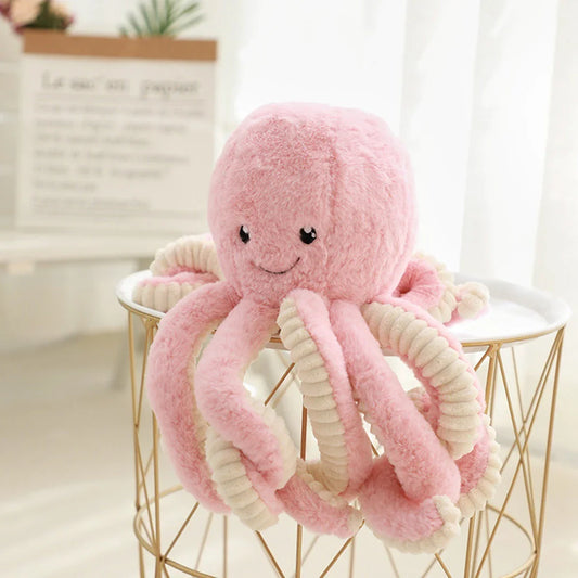 Plush octopus toy with big, bright eyes and a charming, smiling expression