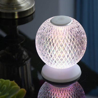 Elegant acrylic crystal bedside lamp with customisable RGB lighting, creating a warm and relaxing atmosphere in the bedroom