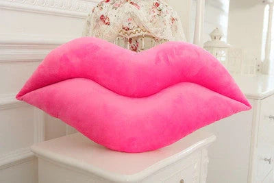Adorable lip-shaped plush pillow for children in pink and red, perfect for cuddles and decor