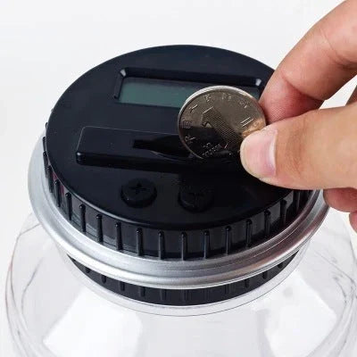 Transparent digital money box with LCD coin counter, designed for effortless coin saving and tracking in the UK