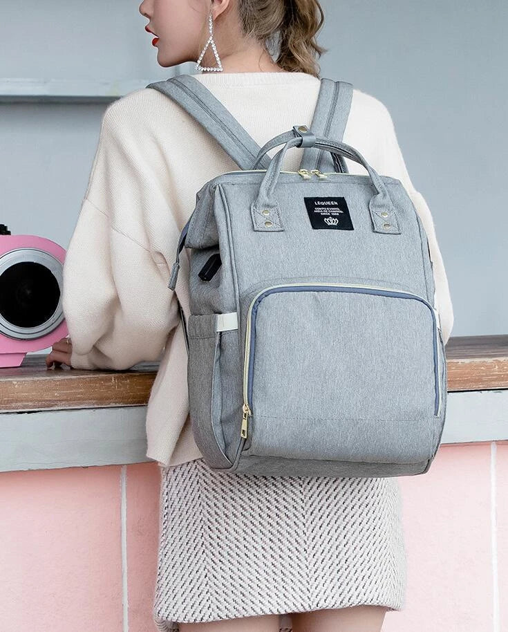 Premium mummy backpack in a range of stylish colours, featuring dedicated compartments for bottles, nappies and personal items.