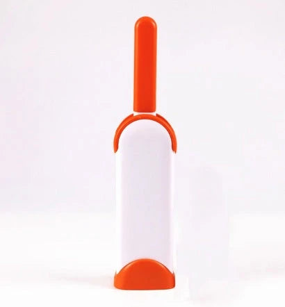 A reusable pet hair remover comb with a self-cleaning base, perfect for removing fur and lint from sofas, chairs, and other upholstery.