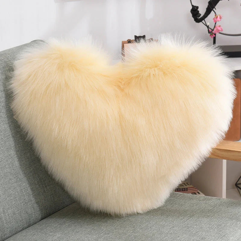 Cozy heart-shaped throw pillow with plush, shaggy texture in various colors