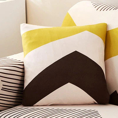 Stretchable geometric print sofa cover on a three-seater sofa