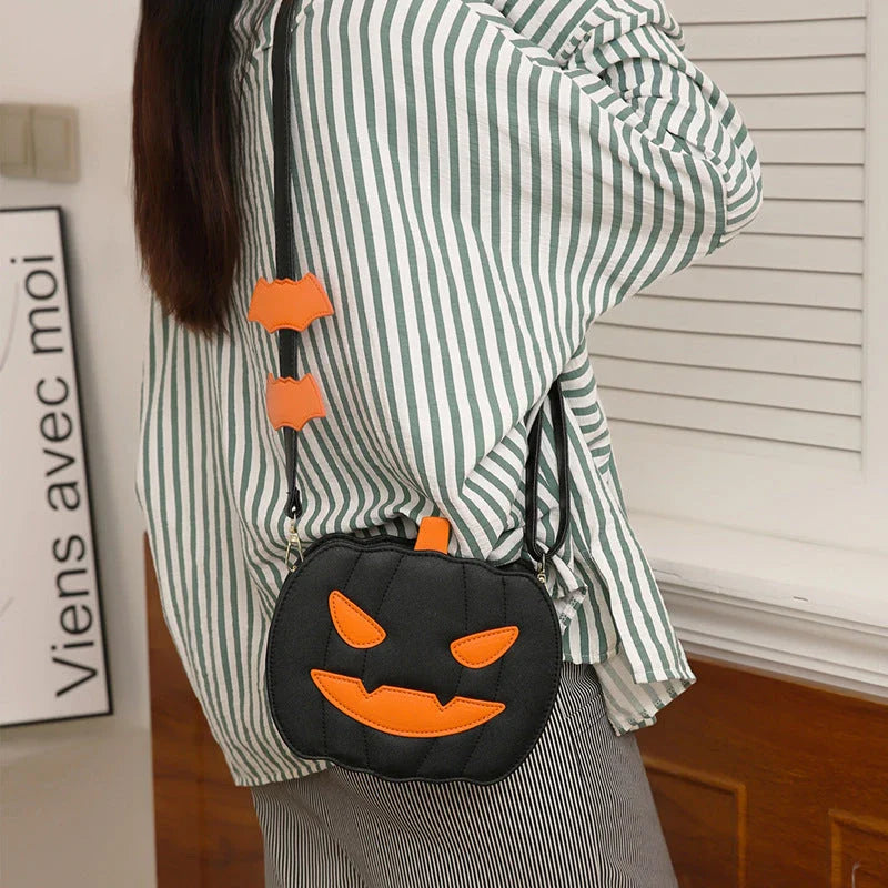 Stylish Halloween shoulder bag with pumpkin cartoon and bat design, available in various color options
