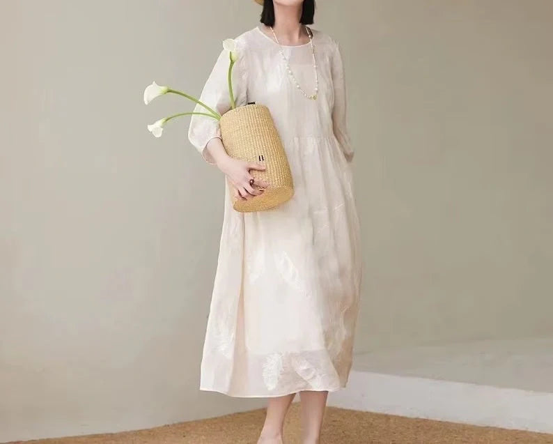 Women's white linen dress with relaxed fit, perfect for summer