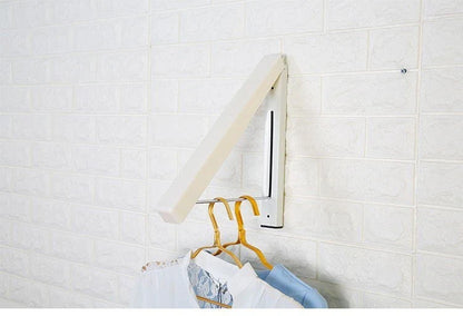 Convenient folding clothes drying rack with sturdy plastic and steel construction, providing generous hanging space for laundry in small living spaces.