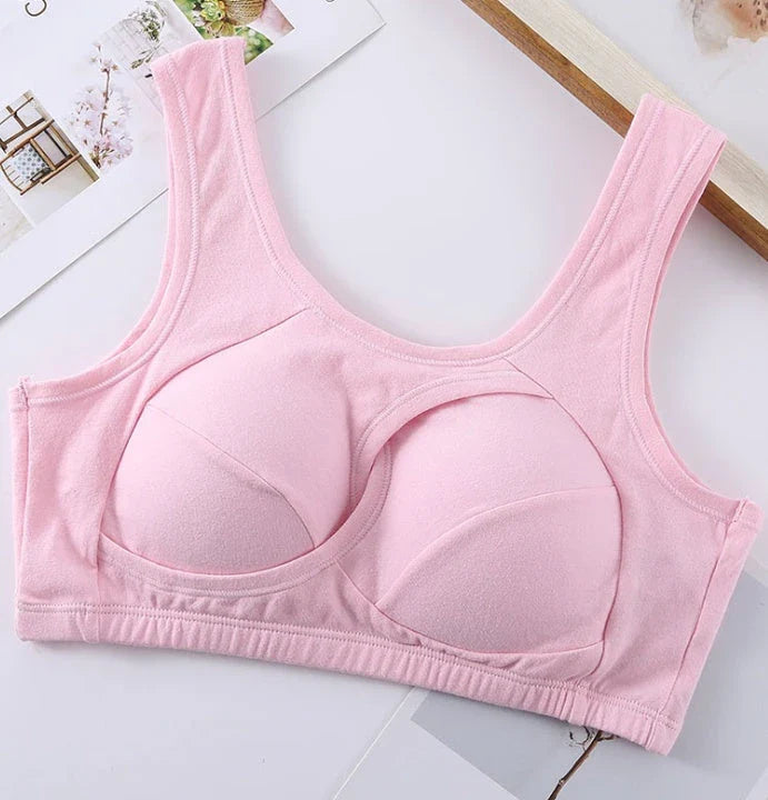 Supportive cotton sports bra with crossover design for lift and support, preventing sagging and bra lines