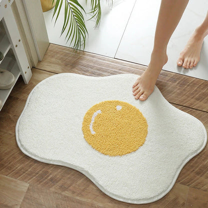 Quirky egg-shaped entrance mat made of absorbent polyester fabric with non-slip rubber backing, available in various sizes and colours