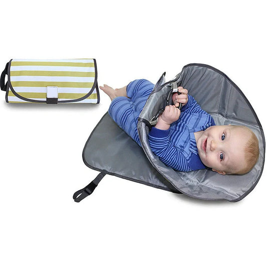 Portable diaper changing pad clutch with built-in toy ring, foldable design for easy transport