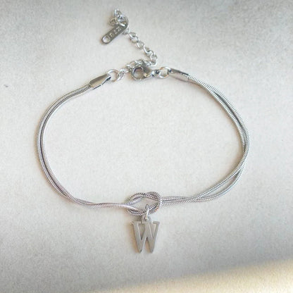 Personalised gold and silver love knot bracelets for couples, perfect as Valentine's Day gifts.