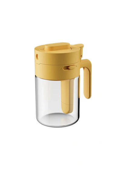 Small glass seasoning jars with lids and built-in spoons for easy measuring and storage