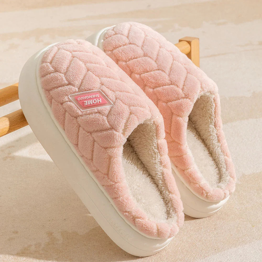 Cosy plush slippers in a variety of vibrant colours, featuring a soft fleece lining and durable non-slip sole for maximum comfort and stability.