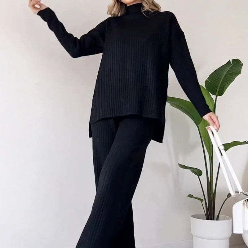 Women's turtleneck knitted suit set in white, black, or green with loose fit and straight trousers