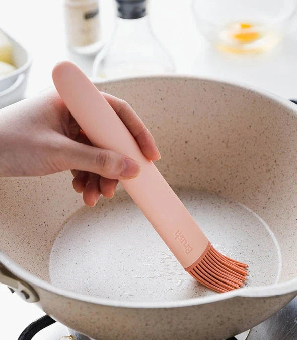 Premium silicone basting brush with sturdy, non-slip handle and flexible head for even distribution of sauces, oils, and glazes on meats, baked goods, and more.