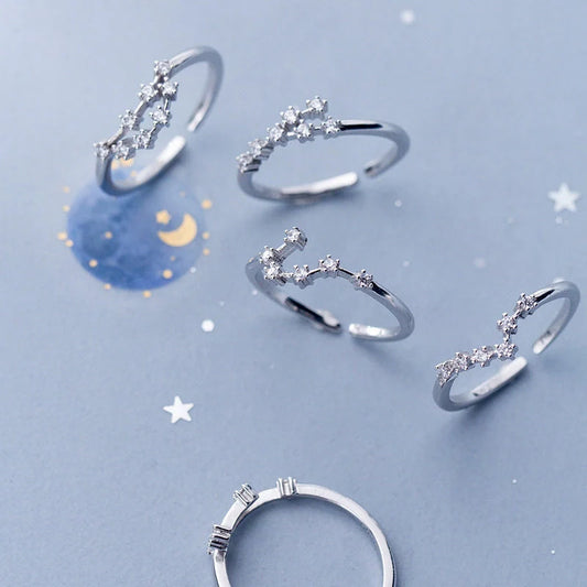 Elegant sterling silver zodiac sign rings in various astrological designs
