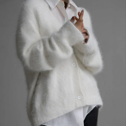 A stylish loose knit cardigan in a variety of colors, featuring a v-neck design and single-breasted closure for a flattering, relaxed fit.