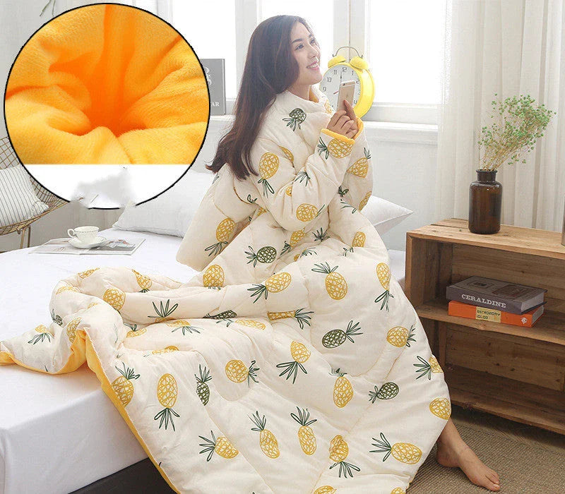 Cozy quilted lounger with sleeves in various colors and sizes, perfect for year-round indoor comfort and relaxation.