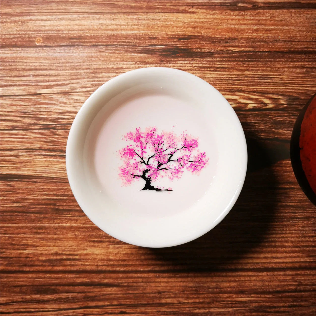 Magic Sakura Cup - Ceramic tea cup with temperature-sensitive sakura design