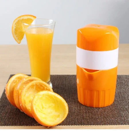 Premium manual citrus juicer with 300ml capacity, made of durable plastic and available in orange and pink colours