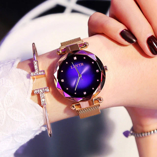 Elegant rose gold ladies' watch with diamond accents on a magnet strap