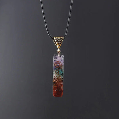 A stunning chakra crystal pendant with natural patterns and organic imperfections, showcasing the beauty of nature.