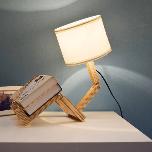 Humanoid table lamp with wooden base and white fabric shade, modern home decor