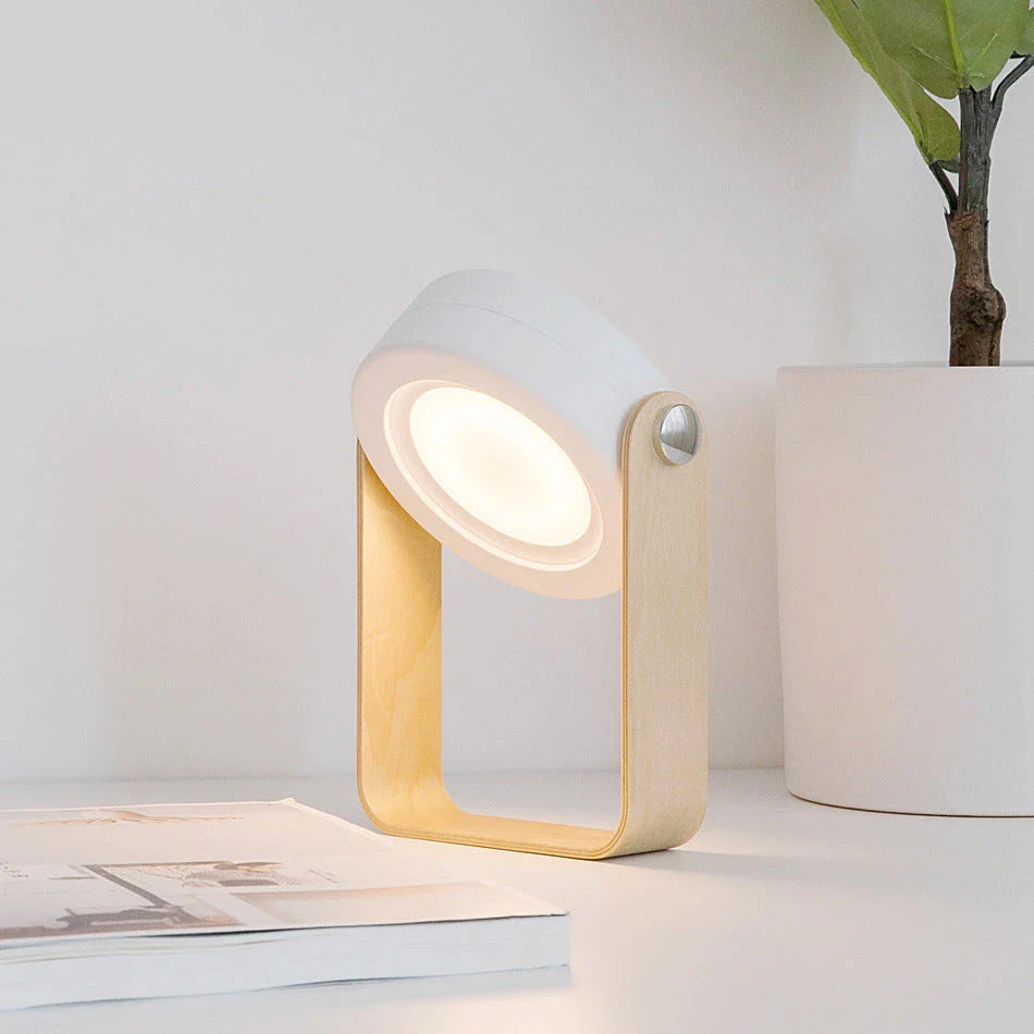 Elegant foldable LED lamp with touch-controlled dimming, rechargeable battery, and modern design for home decor