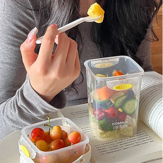 Dual-layer meal prep container with separate compartments and leak-proof lid, available in yellow and cream white colors