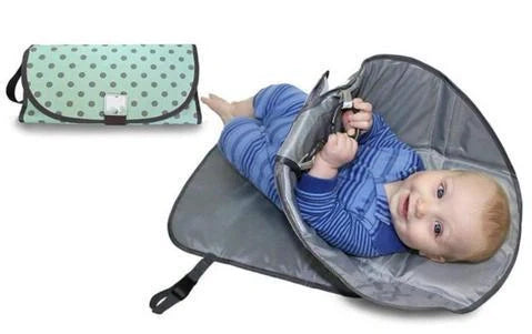Portable diaper changing pad clutch with built-in toy ring, foldable design for easy transport
