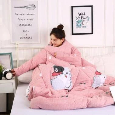 Cozy quilted lounger with sleeves in various colors and sizes, perfect for year-round indoor comfort and relaxation.