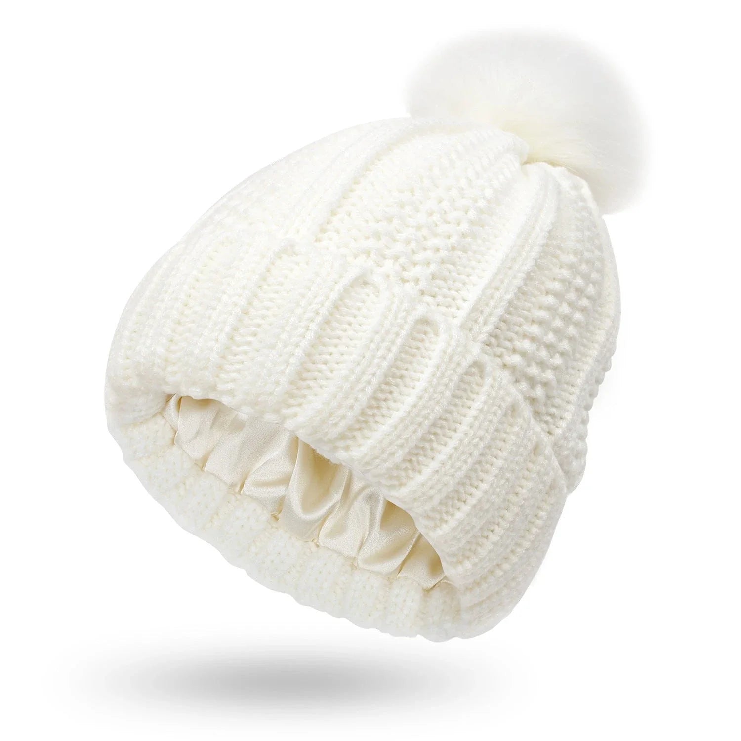 Stylish knit beanie with satin lining and faux fur pom-pom for women, available in multiple color options