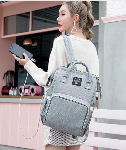 Premium mummy backpack in a range of stylish colours, featuring dedicated compartments for bottles, nappies and personal items.