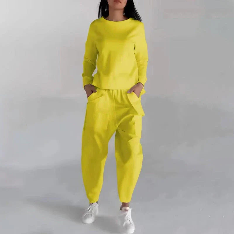 Stylish polyester sweatshirt with back slit, pockets, and available in various colors