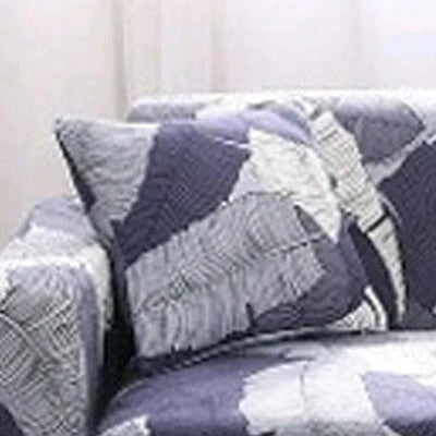 Stretchable geometric print sofa cover on a three-seater sofa