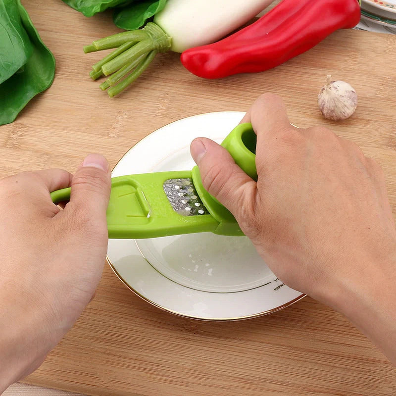 Eco-friendly garlic press and seasoning grinder in rose and green