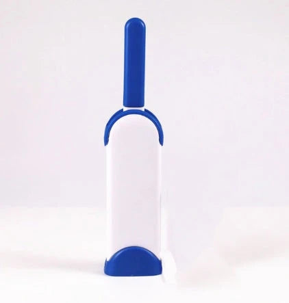 A reusable pet hair remover comb with a self-cleaning base, perfect for removing fur and lint from sofas, chairs, and other upholstery.